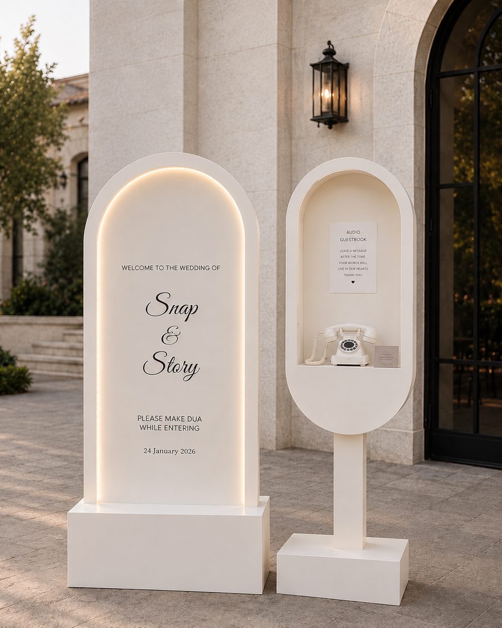 Welcome sign and audio guest book styled with white flowers