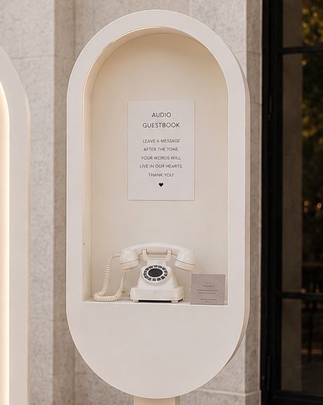Vintage telephone in an arched alcove with audio guestbook sign